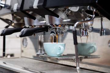 professional barista hand making latte art coffee pour white milk forth on top coffee glass , coffee maker Italian school.