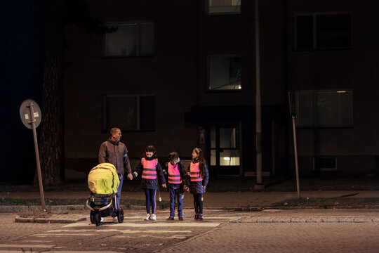 Father with children walking at evening