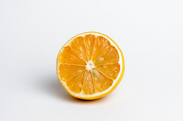 sliced dried lemon on a white background