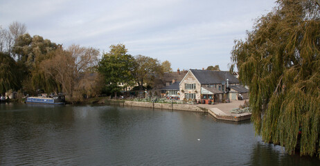 Fototapeta na wymiar Views along The Thames at Lechlade, Gloucestershire in the United Kingdom with The Riverside Pub
