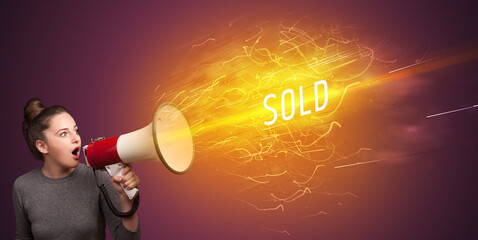 Young girld shouting in megaphone with SOLD inscription, online shopping concept