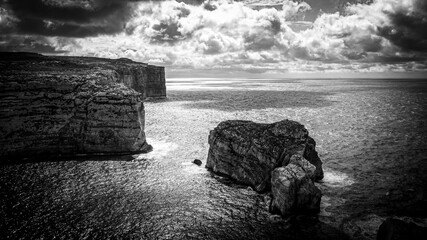 The remains of Azure Window at Dwerja Bay at the coast of Gozo Malta - aerial photography