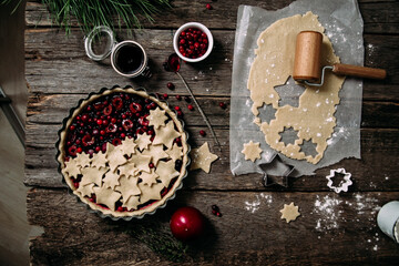 Making a shortcrust pastry pie with cherries and cranberries.Dough on the table