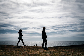 silhouettes with the Baltic Sea in the background