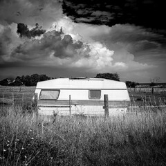an abandoned caravan in an idyllic pasture