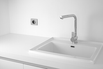 Modern bathroom interior with sink and chrome faucet. White color background