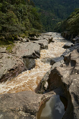 Wild water of the rapids at the Estrecho de Magdalena, close to San Agustin, is the narrowest point of the magdalena river in Colombia, South America
