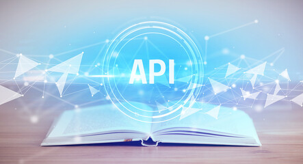 Open book with API abbreviation, modern technology concept