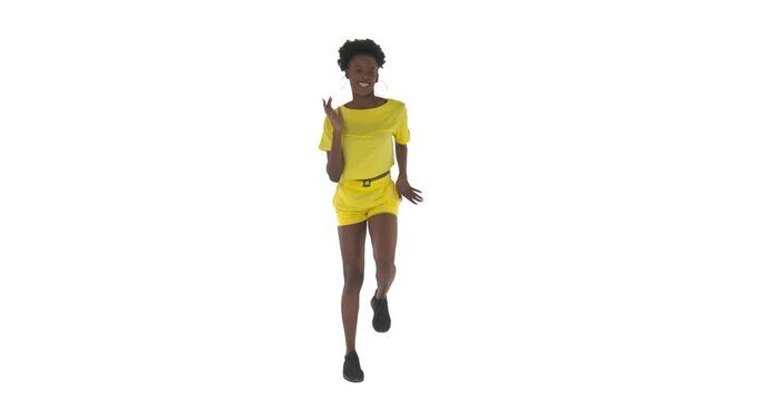 Full length portrait of African woman dancing like running man and turning around. Shuffle dance. Isolated on white background.
