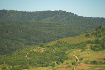 Fototapeta premium Panorama of the village in the autumn morning among the mountains