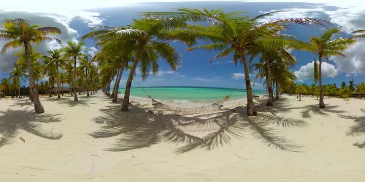 Beautiful tropical island with sand beach and hammock. Panglao, Philippines. Seascape with beautiful beach and palm trees. 360 panorama VR.