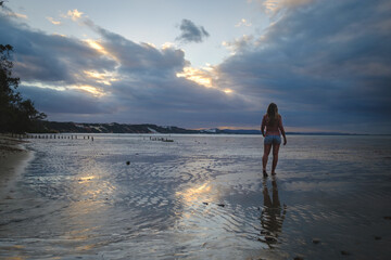 a man walking on a beach