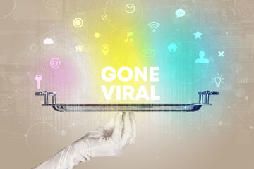 Waiter serving social networking with GONE VIRAL inscription, new media concept