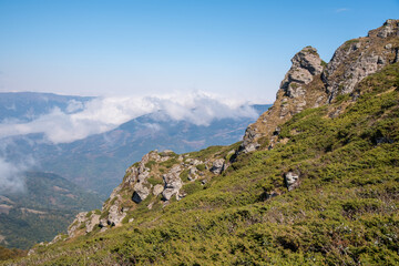 View from the top of Babin zub (The Grandmather's tooth) on Old mountain, which is the most beautiful peak of Stara planina ( Balkan mountains).The impressive and big striking rocks and dense plants.