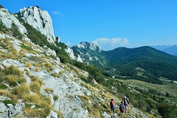 Fototapeta na wymiar Croatia-view of the tourists under the top of Kiza in the Velebit National Park