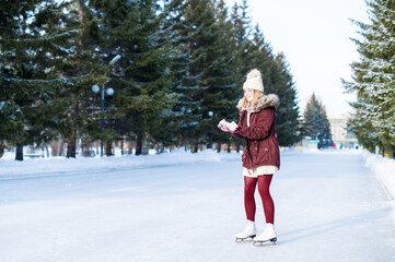 Beautiful girl having fun in winter park