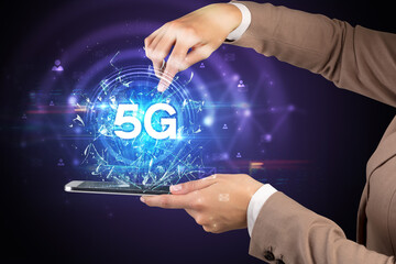 Close-up of a touchscreen with 5G abbreviation, modern technology concept