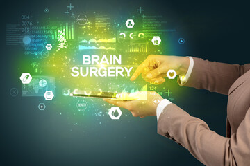 Close-up of a touchscreen with BRAIN SURGERY inscription, medical concept