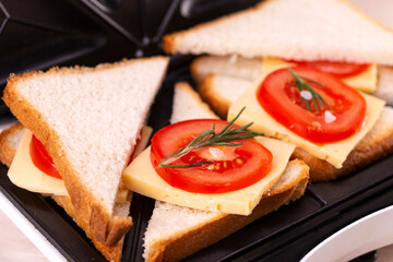 Making Cheese and Tomato Sandwiches on a Sandwich Press