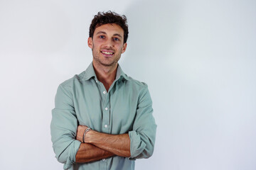 portrait of a young caucasian looking at the camera with arms crossed