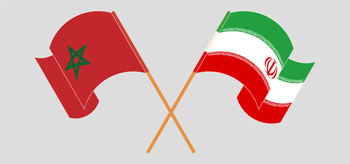 Crossed and waving flags of Morocco and Iran
