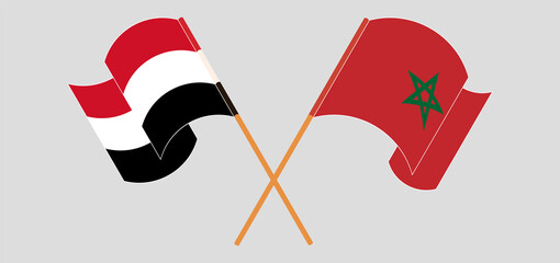 Crossed and waving flags of Yemen and Morocco