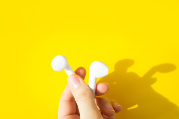 White wireless headphones. Gadget and technology concept with copy space.