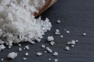 Flower of salt from Guerande - France. Natural sea salt close up on a slate background.