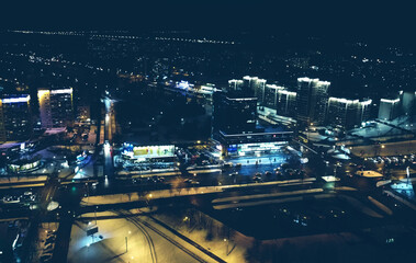 Fototapeta na wymiar Top view of the night winter city with lights and lanterns