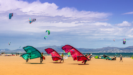 kitesurfers at the surfschool, on the beach learning to surf
