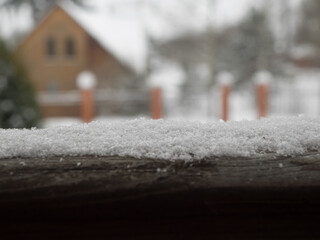 Snow surface. The background of country house