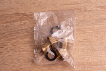 Domestic water supply brass fittings kit. 1/2 union, nuts and rubber washers.
