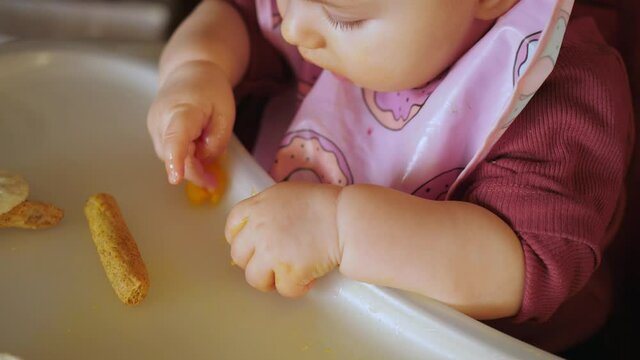 little baby infant eating baby-led led baby weaning blw food chair hands