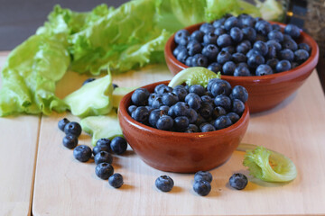 blueberries in a bowl and lettuce