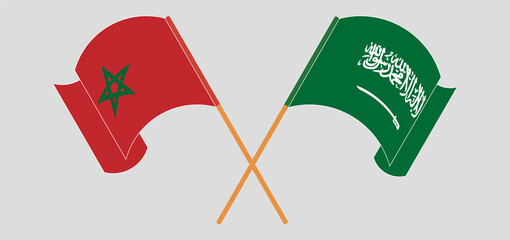 Crossed and waving flags of Morocco and the Kingdom of Saudi Arabia