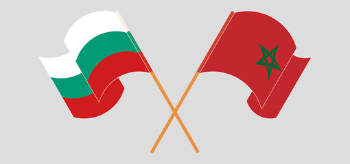 Crossed and waving flags of Bulgaria and Morocco