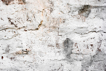 Texture of a brick wall with cracks and scratches which can be used as a background