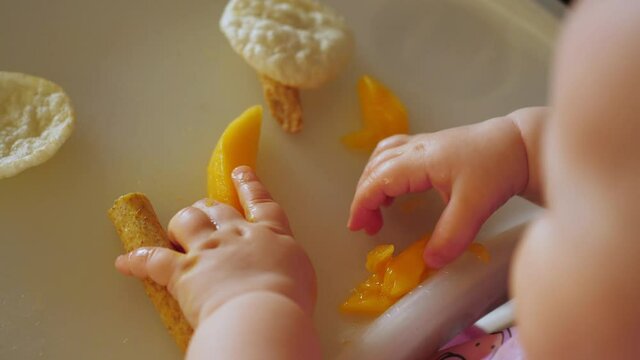 little baby infant eating baby-led led baby weaning blw food chair hands