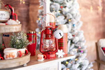 Vintage red lantern and thermoses on holiday hot cocoa bar