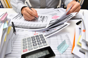 business concept - businessman working with reports in office, table and workspace close view,...