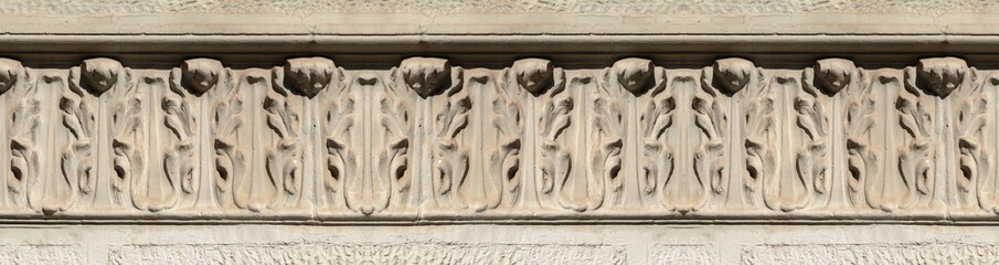 Elements of architectural decorations of buildings, gypsum stucco, wall texture, plaster molding and patterns. On the streets in Catalonia, public places. © Kozlik_mozlik