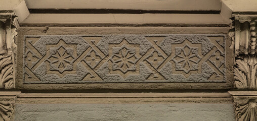 Elements of architectural decorations of buildings, gypsum stucco, wall texture, plaster molding and patterns. On the streets in Catalonia, public places. © Kozlik_mozlik