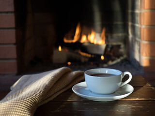 A Cup of tea on the background of the fireplace