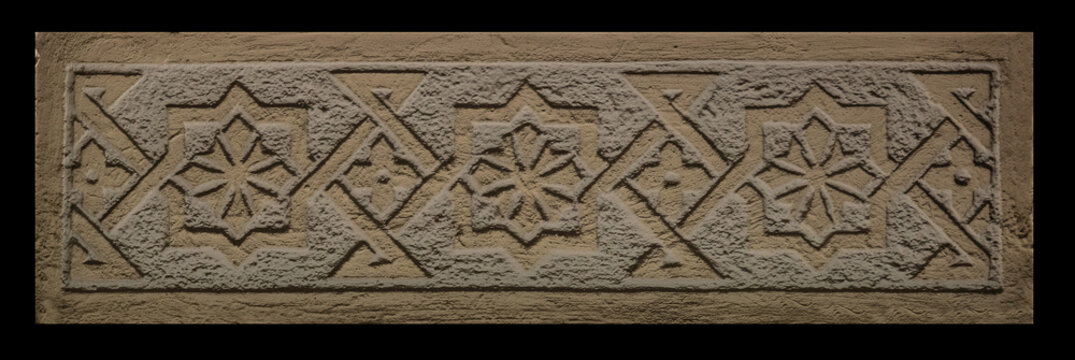 Elements of architectural decorations of buildings, gypsum stucco, wall texture, plaster molding and patterns. On the streets in Catalonia, public places.