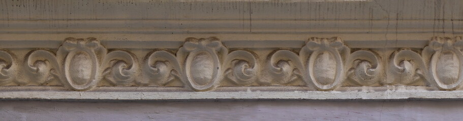 Elements of architectural decorations of buildings, gypsum stucco, wall texture, plaster molding and patterns. On the streets in Catalonia, public places. © Kozlik_mozlik