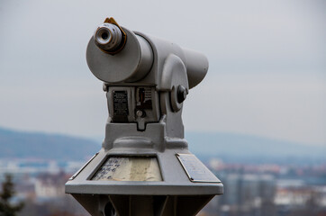 Grey Monocular in front of grey sky. High quality photo