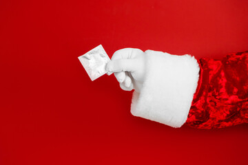 Santa hand with condom. Sex contraception