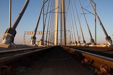 Empty tram railing on the meddle of bridge.  