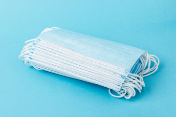 medical mask isolated on blue background. Face mask protection against pollution, virus, flu and coronavirus.