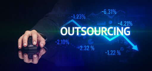 male hand holding wireless peripheral with OUTSOURCING inscription, modern business concept